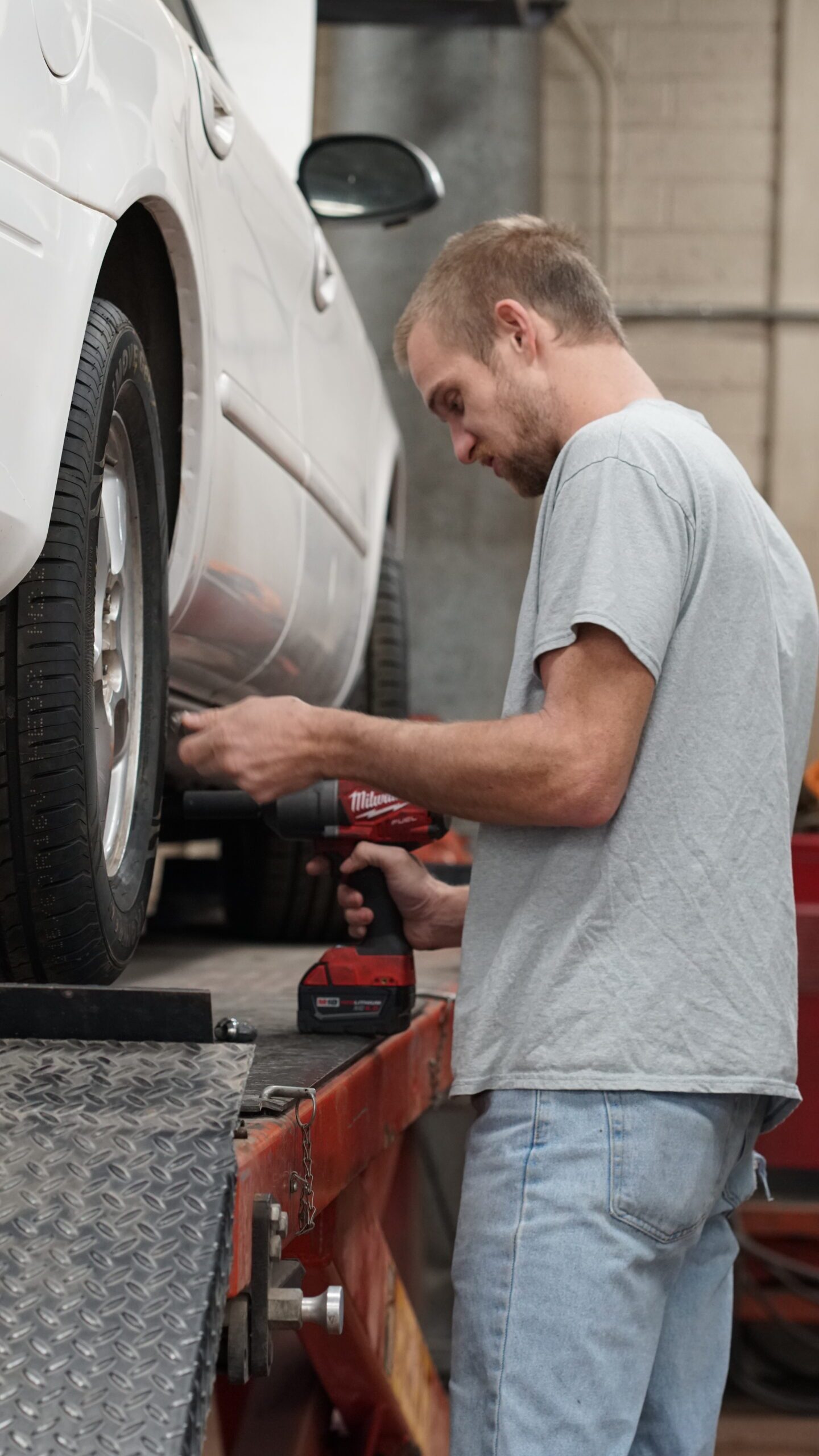 Automotive student working on a car