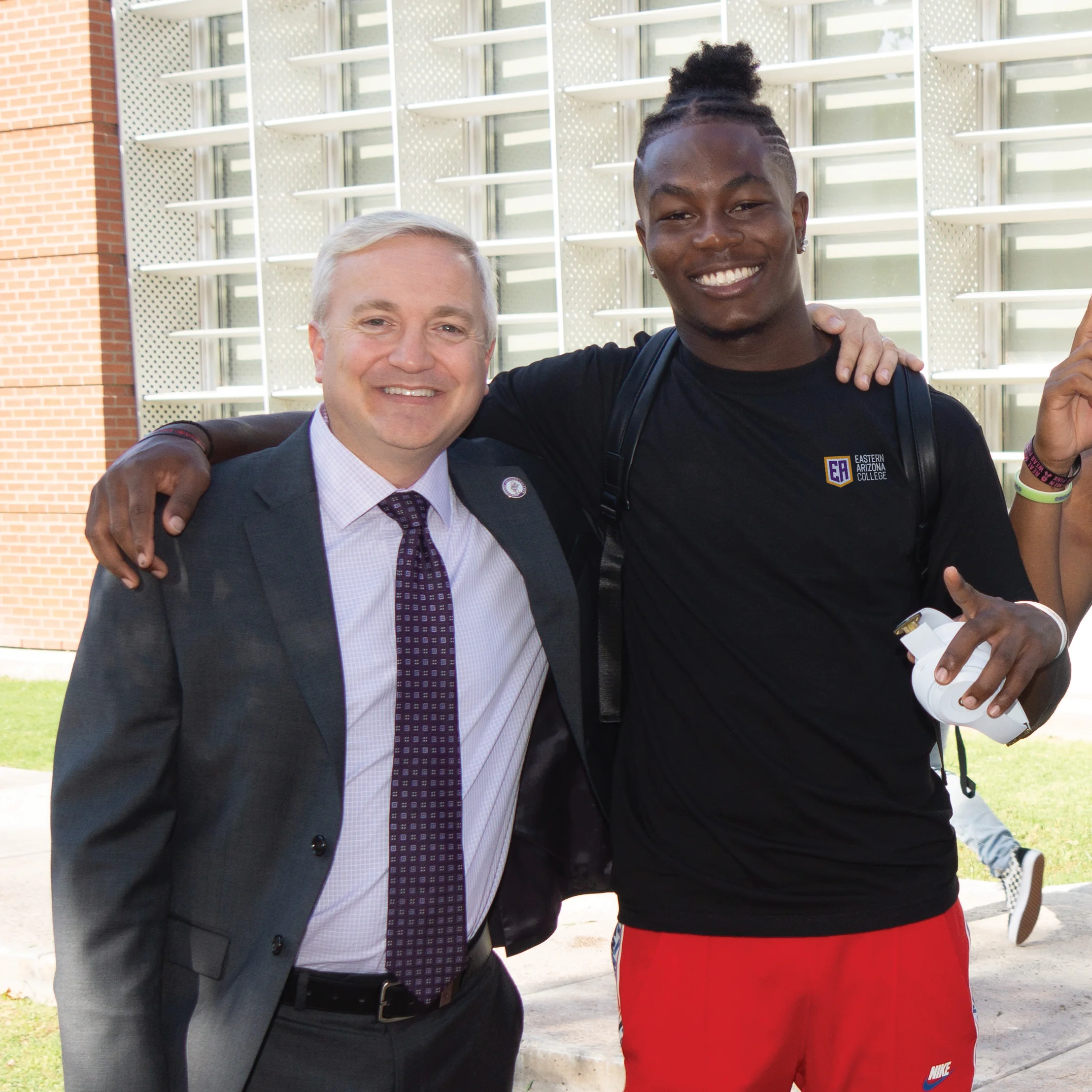 EA President Todd Haynie poses with a college student.