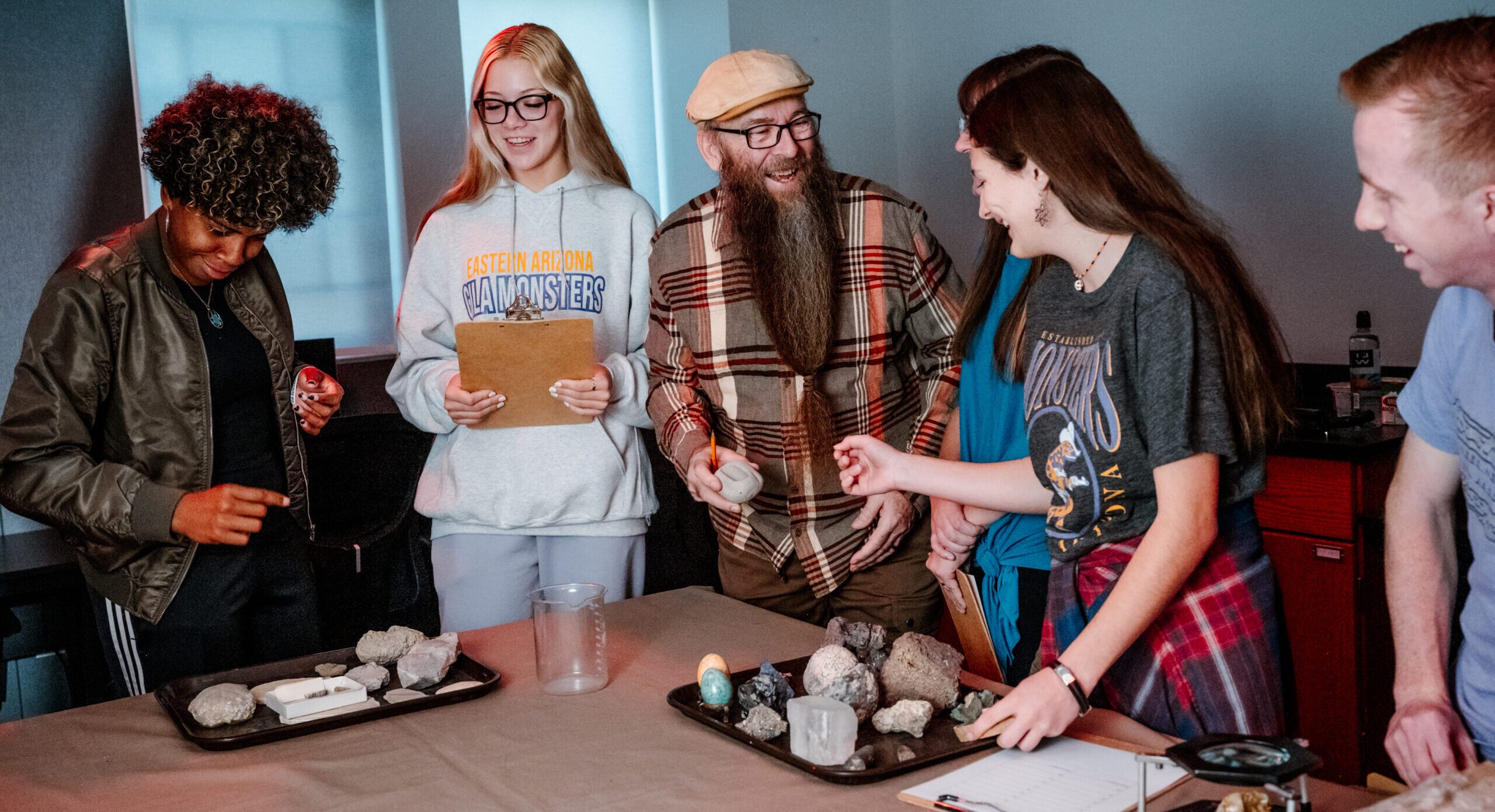 A professor instructs EA students with hands-on laearning.