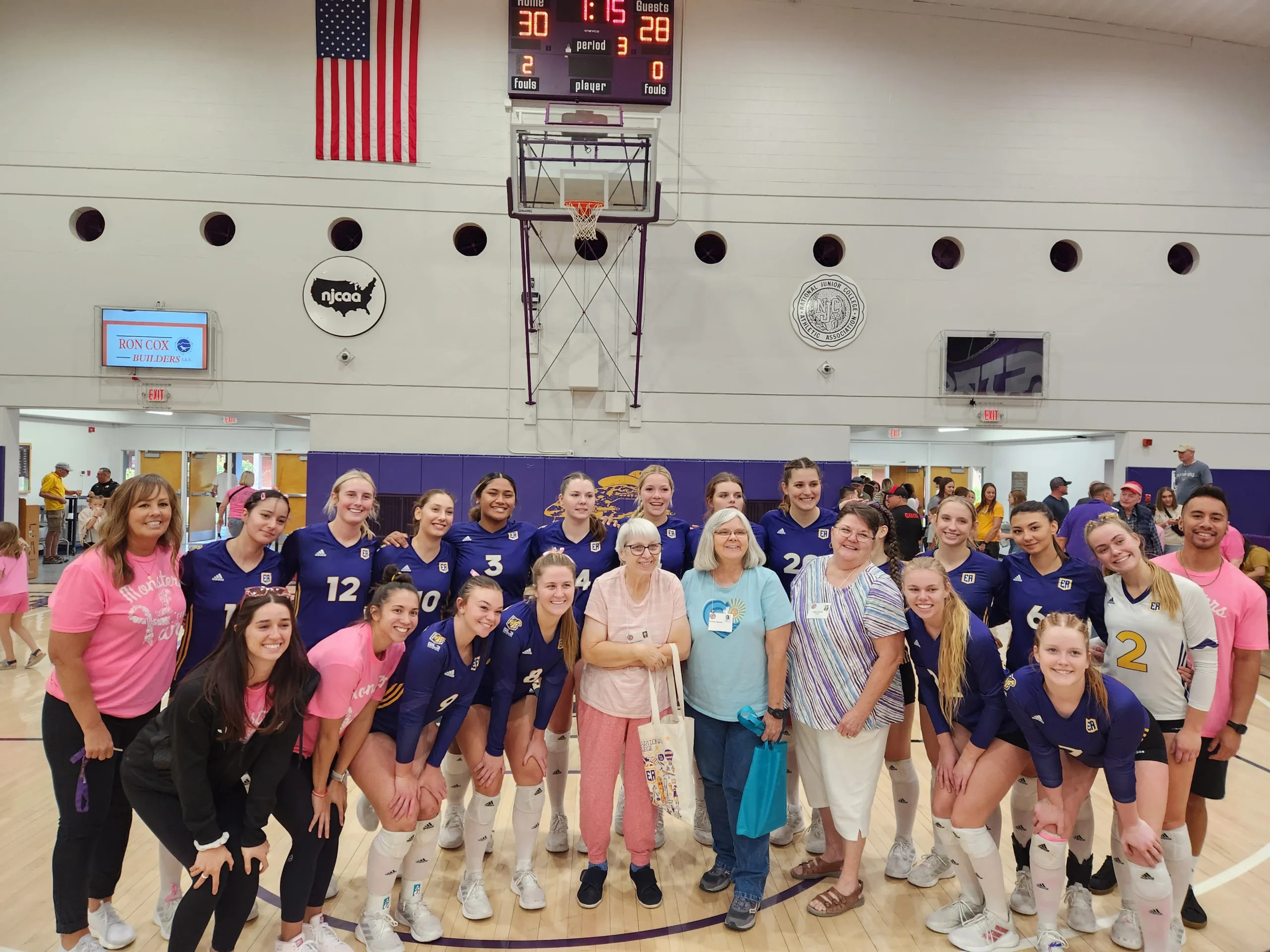 Eastern Arizona College’s Gila Monster Volleyball Team pose with members of the 1973 EAC Volleyball Team who won the AIAW national championship 50 years ago.