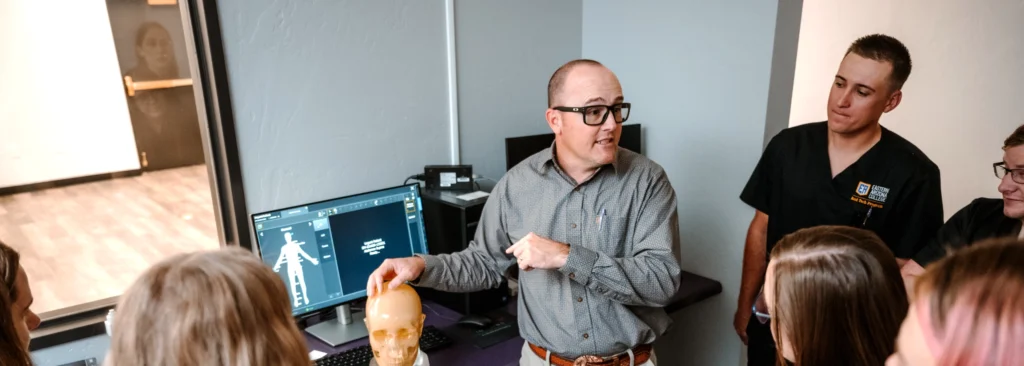 Teacher exposing radiology skull