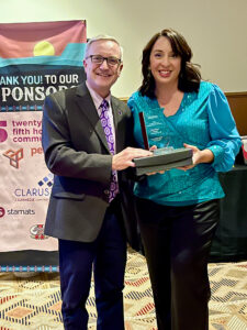 EAC President Todd Haynie accepts the 2024 Pacesetter of the Year Award from Mandy Heil, District 6 director of the National Council for Marketing & Public Relations. (EAC photo)