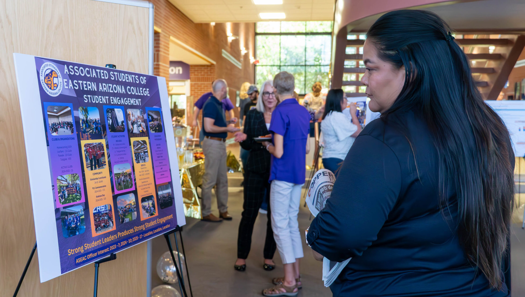 A member of the community looks over an assessment evaluation and action plan.