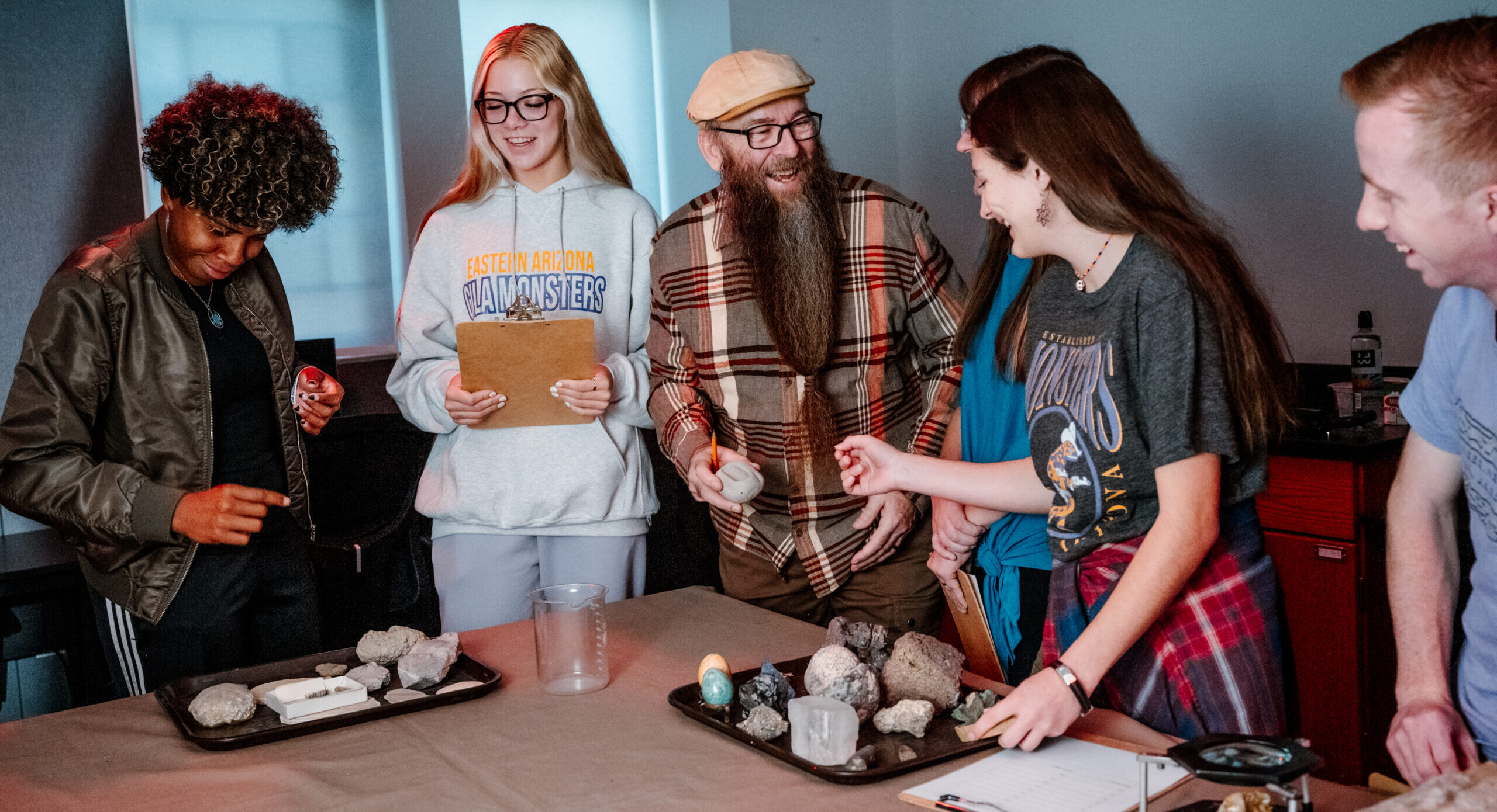 A professor instructs EA students with hands-on laearning.