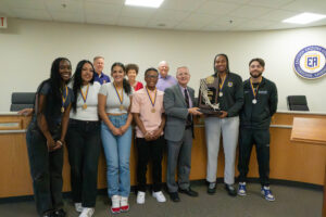 EAC student-athletes receive Presidential Medals from EAC President Todd Haynie and other board members 